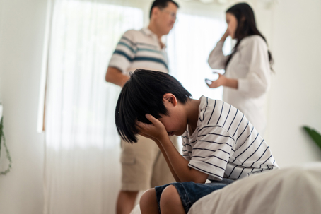 child frustrated with parents fighting